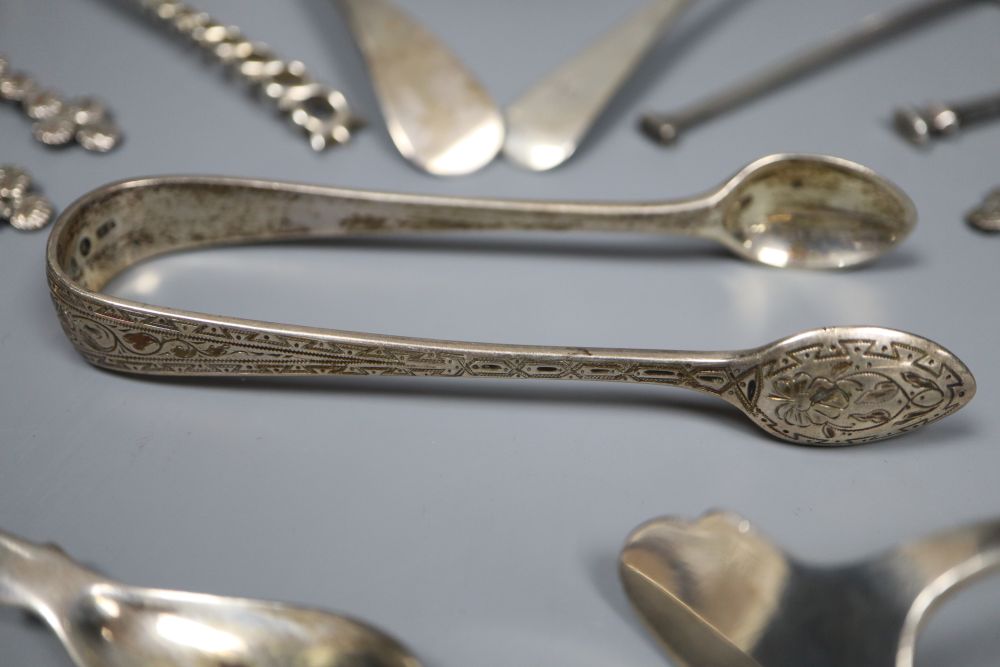 A George V silver vesta case and thirteen pieces of cutlery including eight silver.